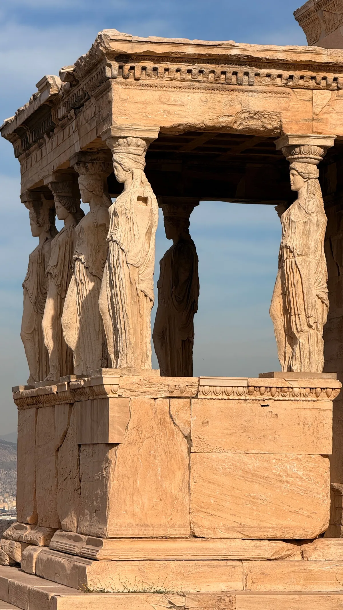 Caryatid porch of the Erechtheion in side light, six sculpted women carrying the roof