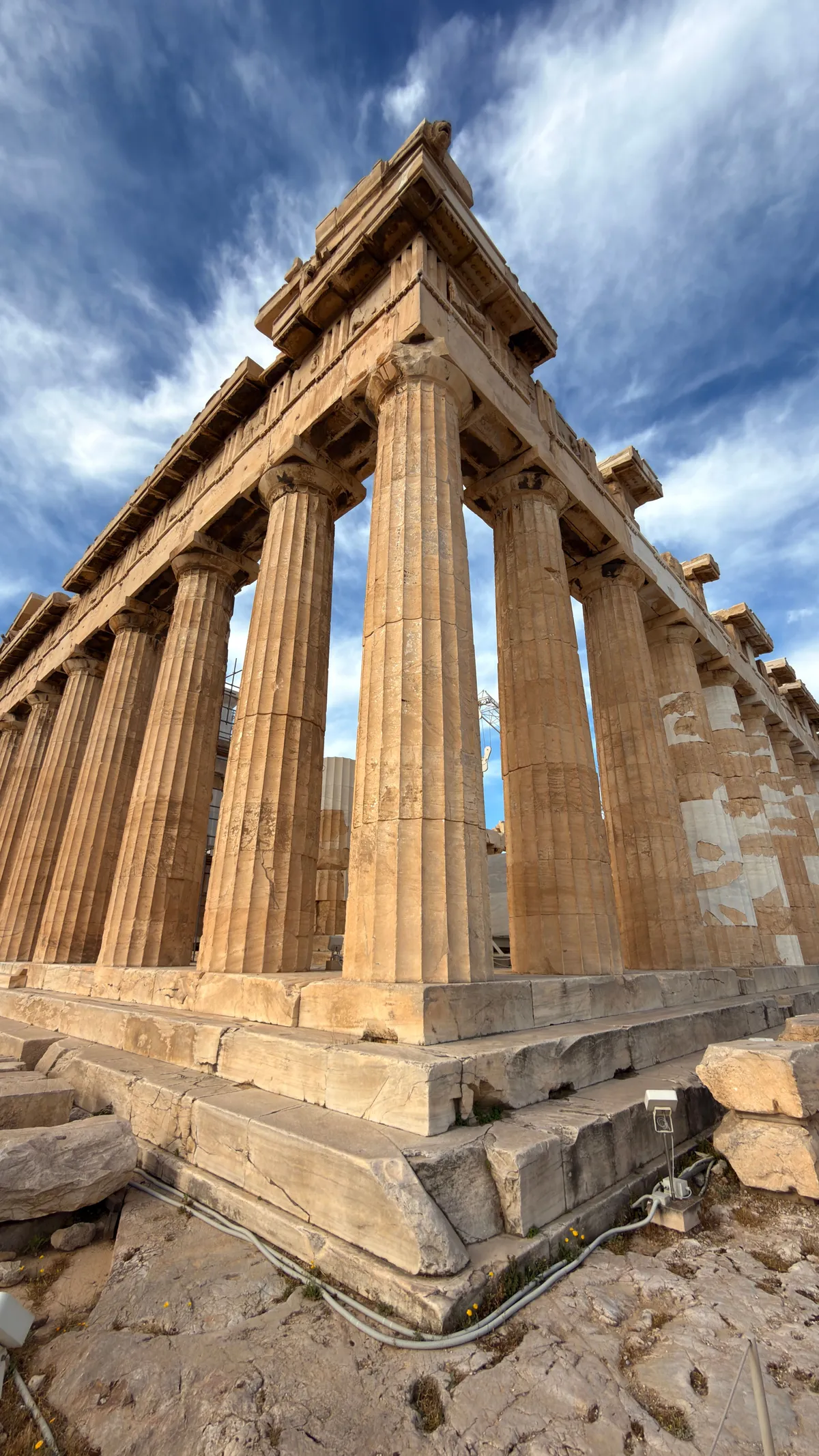 Corner of the Parthenon on the Acropolis under cirrus clouds, Doric columns from a low angle