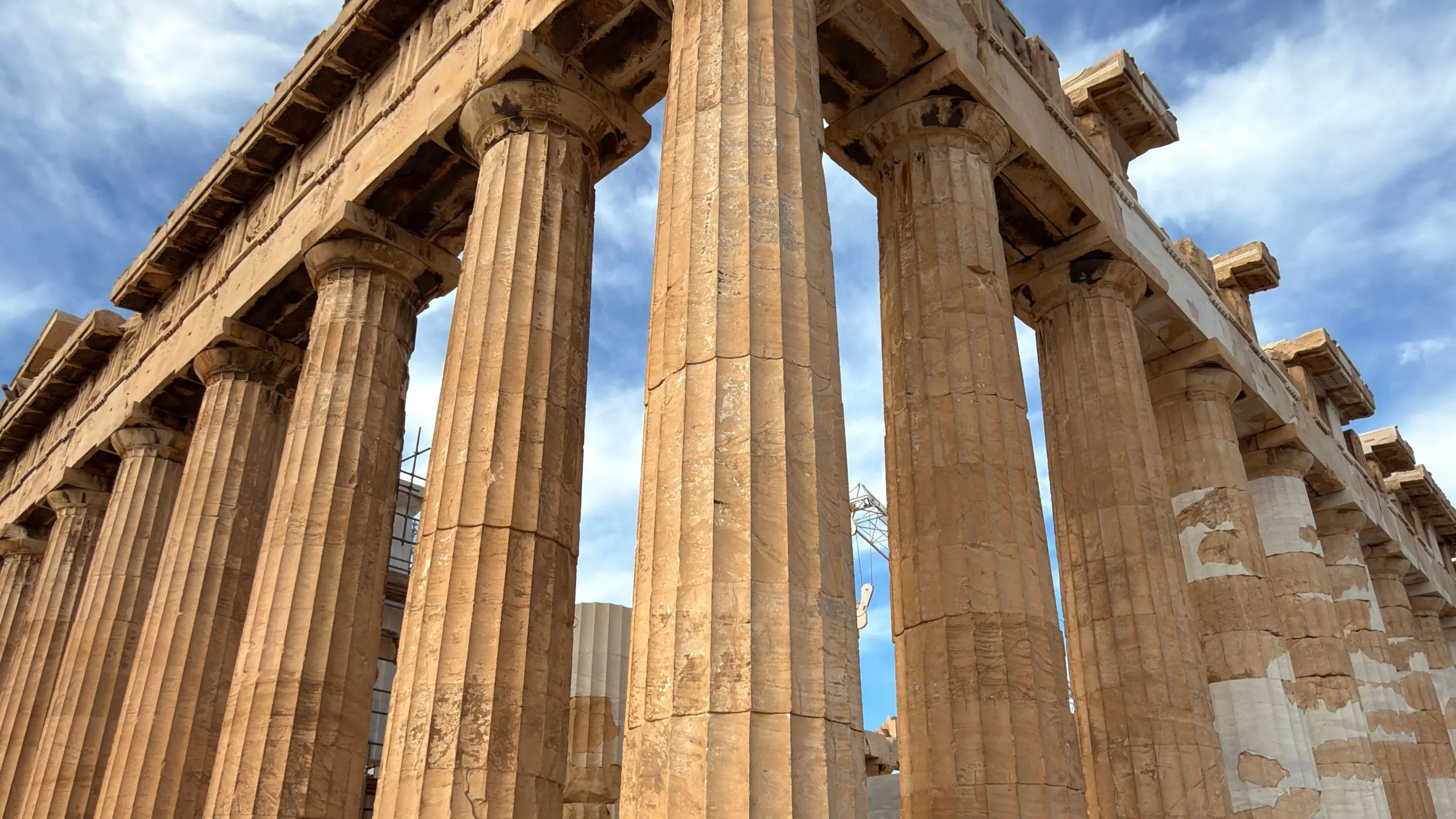 Corner of the Parthenon on the Acropolis under cirrus clouds, Doric columns from a low angle
