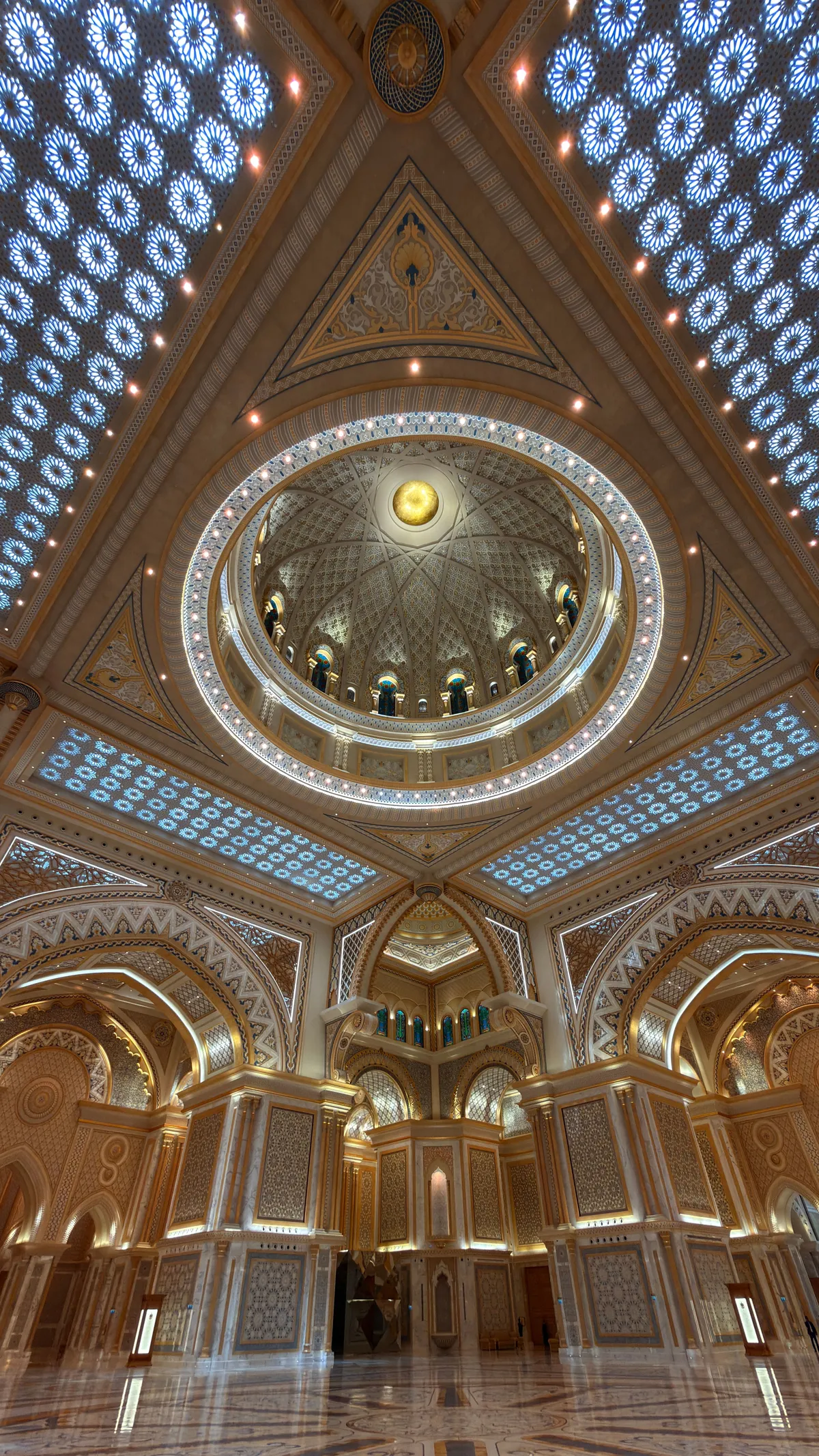 Ornamented dome hall of the Qasr Al Watan palace, looking straight up into the dome