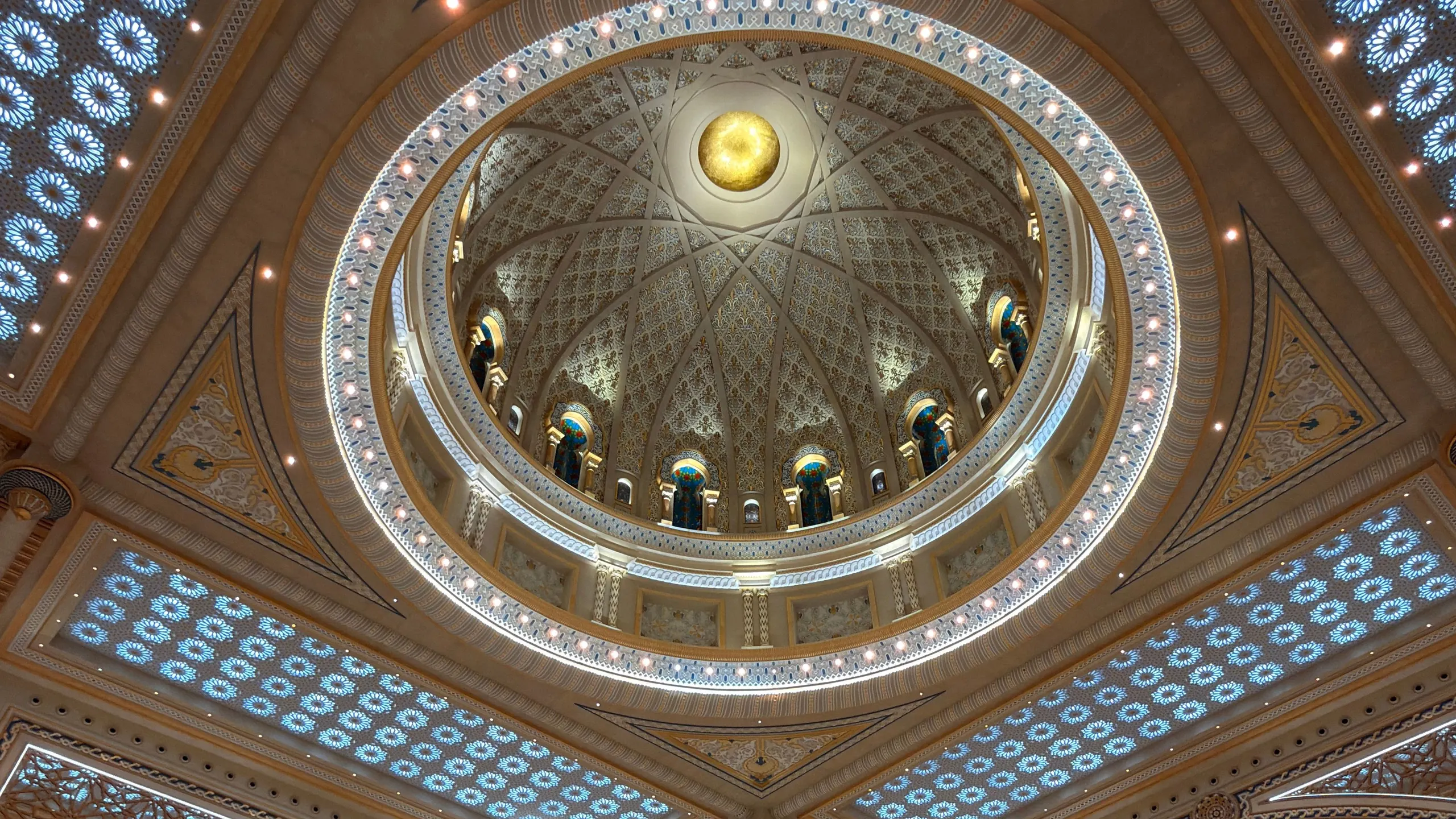 Ornamented dome hall of the Qasr Al Watan palace, looking straight up into the dome